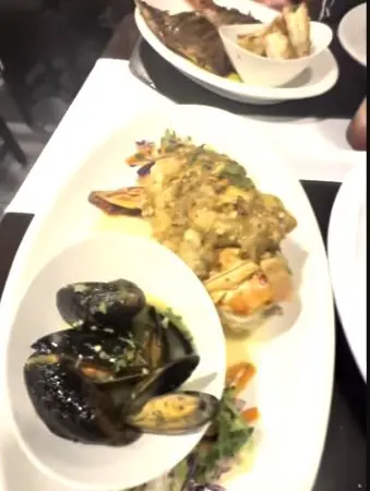 Cooked lobster and mussels at Caramba in IAmLuhhShayy’s San Pedro vlog