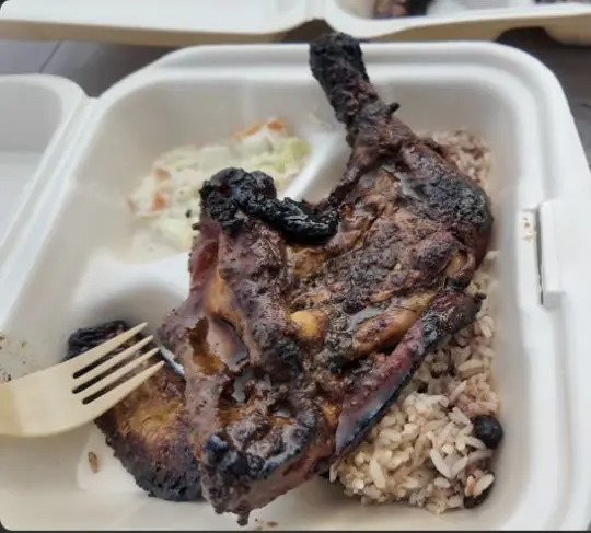 Barbecue jerk chicken, rice and beans at Chef Kareem in Zenese Ashley’s Caye Caulker vlog
