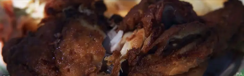 Fried chicken, shown in Malini Angelica’s vlog
