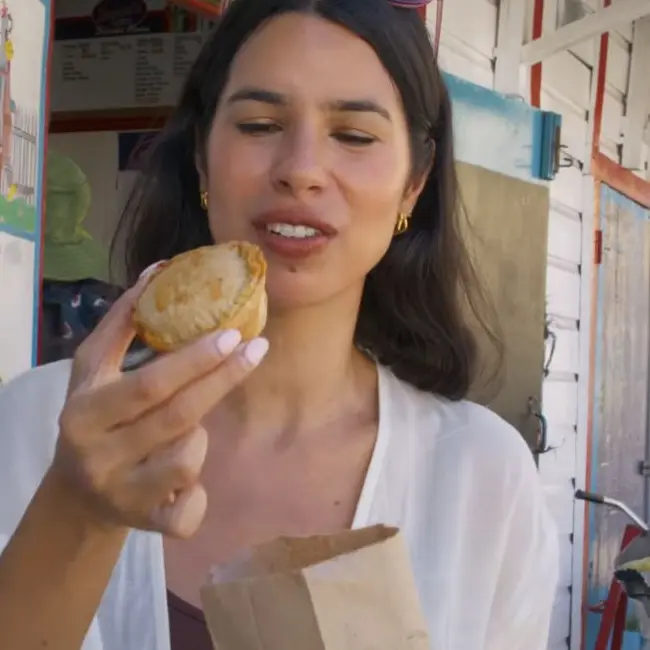 Hot meat pie, shown in Malini Angelica’s vlog
