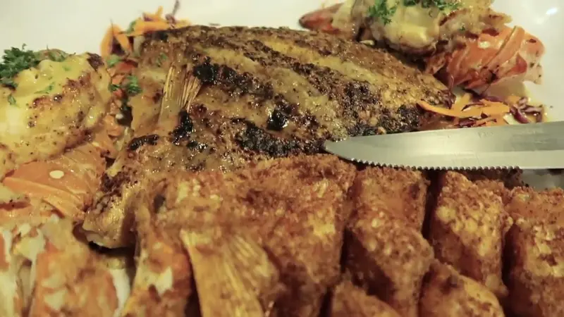 Seafood platter shown in NurseAggz’s San Pedro vlog; restaurant name unconfirmed