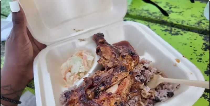 Santia’s barbecue chicken with rice, beans and coleslaw