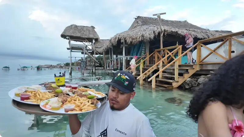 Seafood platters being served over the water at Blue Bayou in Kay Flash’s vlog