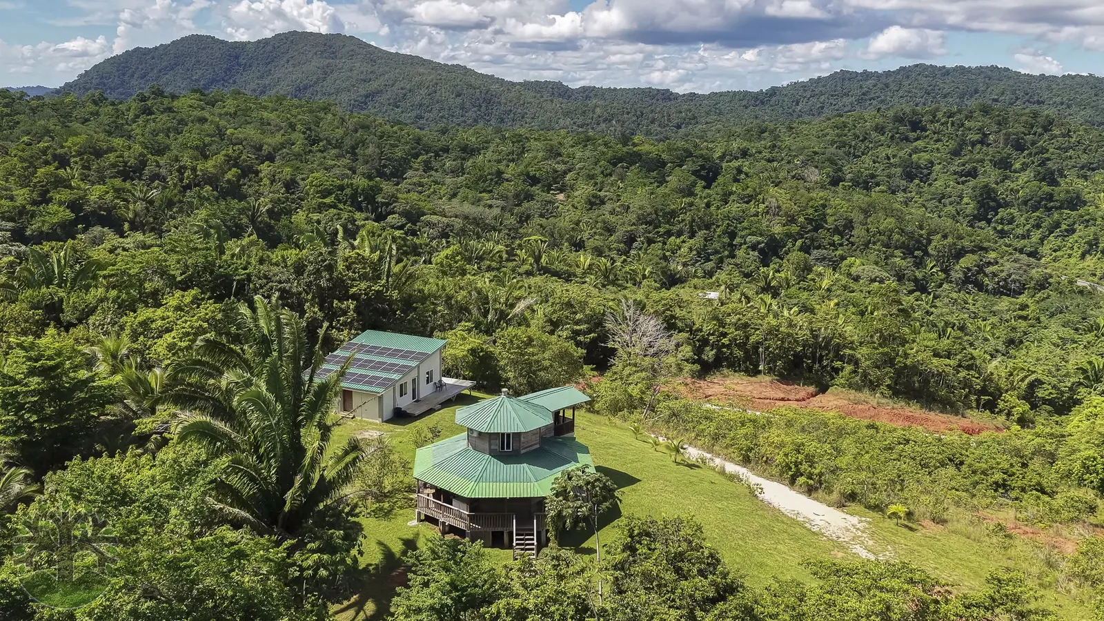 23 Acres w/ Creek & Homes in Hummingbird Hwy Area