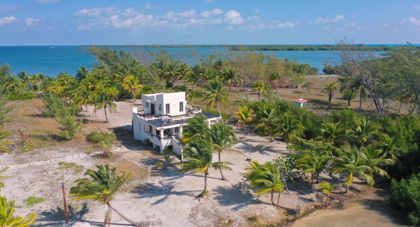 Beachfront Bliss! 2 Bed,2 Bath Home/Two Waterfronts-St Georges Caye on 0.6 acres