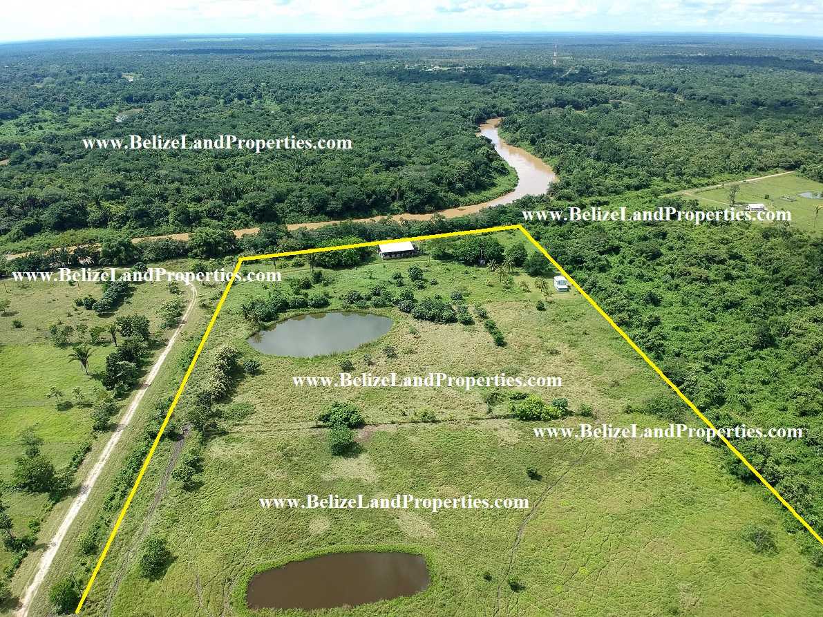 BZ125: CALL FOR AVAILABILITY AND PRICE!2 BUILDINGS ON 58.47 ACRES WITH +-718 FEET ALONG THE BELIZE RIVER!