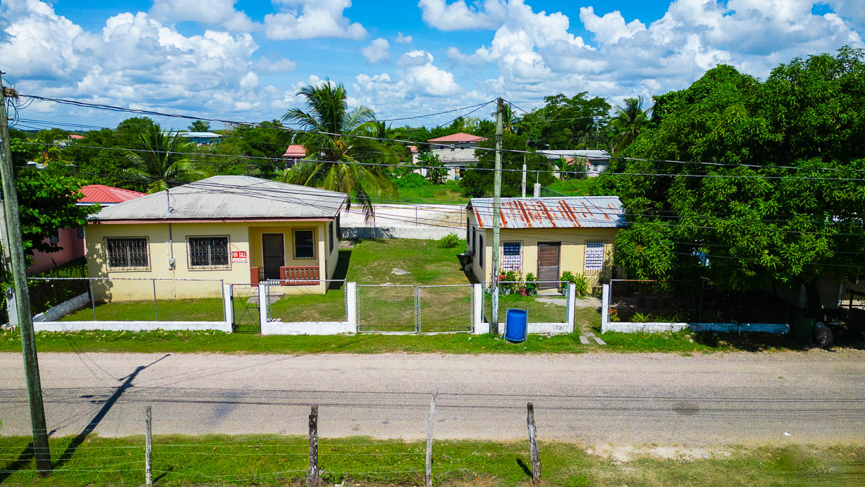 Two concrete bungalow-style houses on a single parcel located on Princess Diana Street, in the Pasadita Area of Orange Walk Town, Northern Belize.