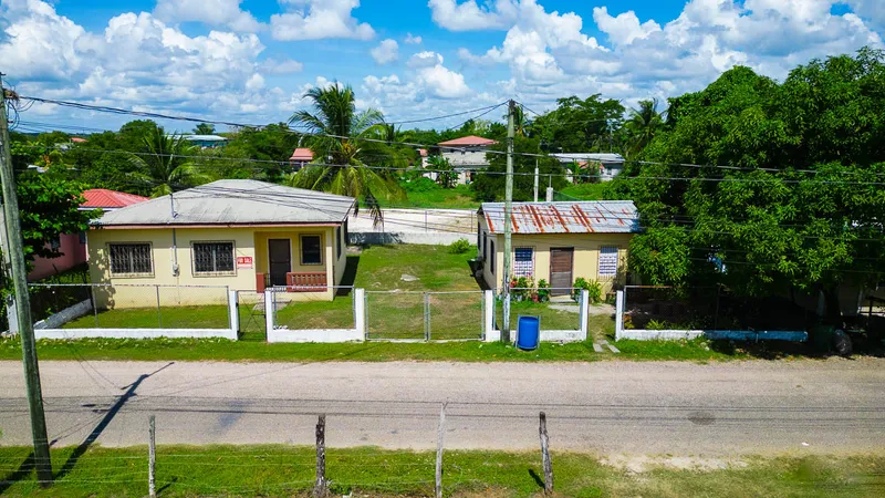 Two concrete bungalow-style houses on a single parcel located on Princess Diana Street, in the Pasadita Area of Orange Walk Town, Northern Belize.