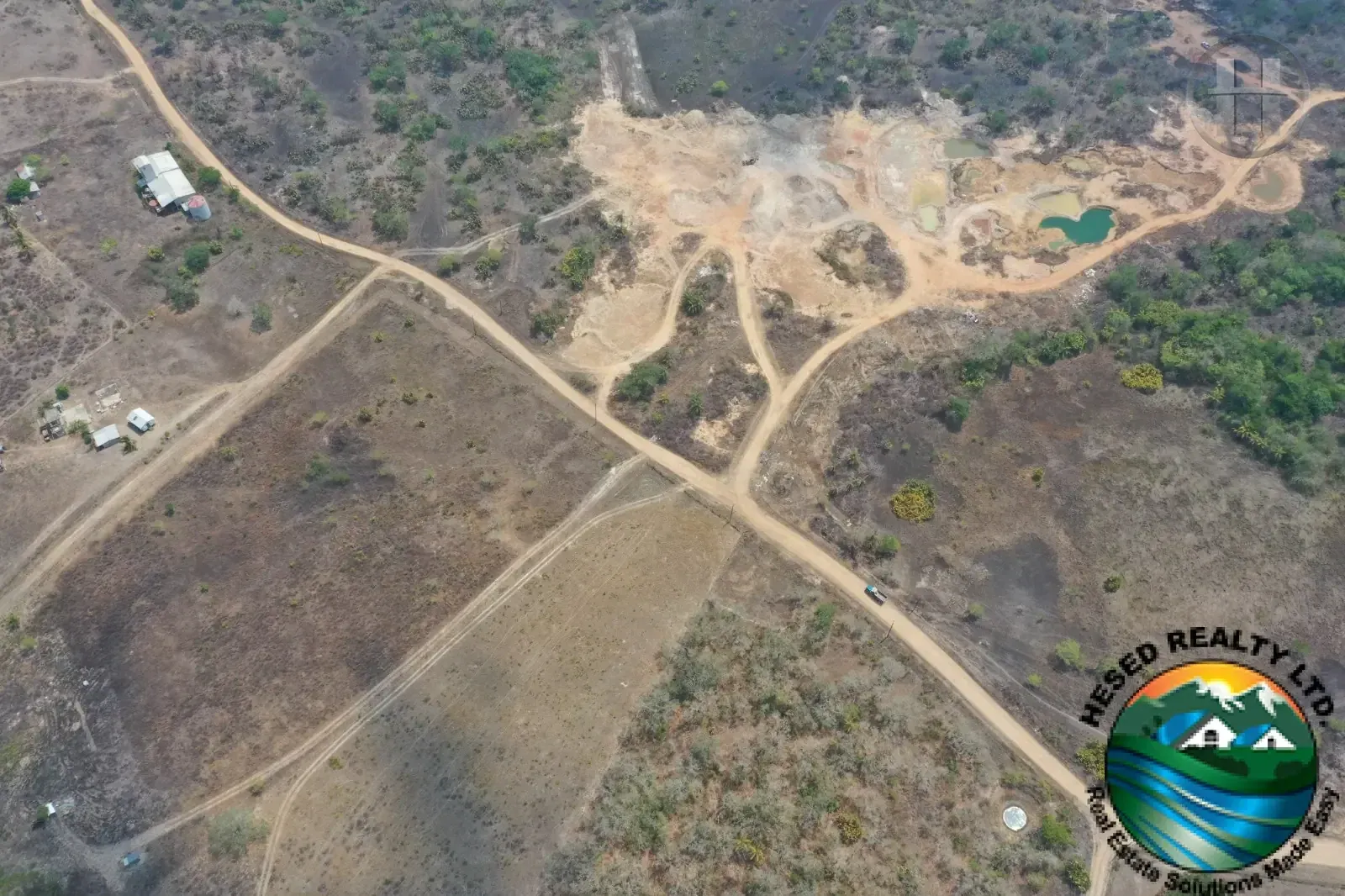 69-Acre Flat Parcel with Ponds and Gravel Reserves in Billy White, Cayo