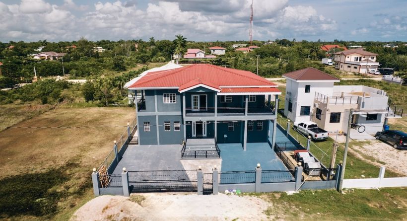 Impressive Two-Storey 4-Bedroom Home with Covered Pool in Ladyville