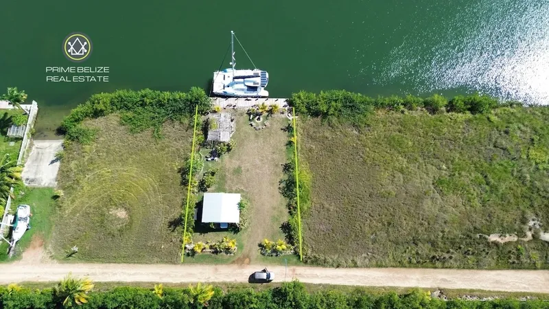 PL0197 – Private Waterfront lot in Wild Orchid Marina, Placencia – Titled & Ready to Build