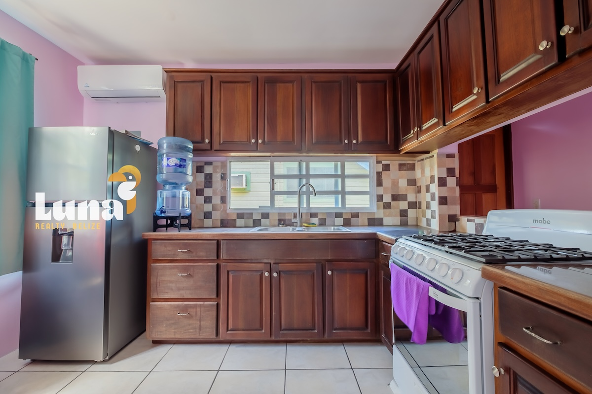 Duplex within San Pedro Town – Solid Concrete Structure on Fenced Lot