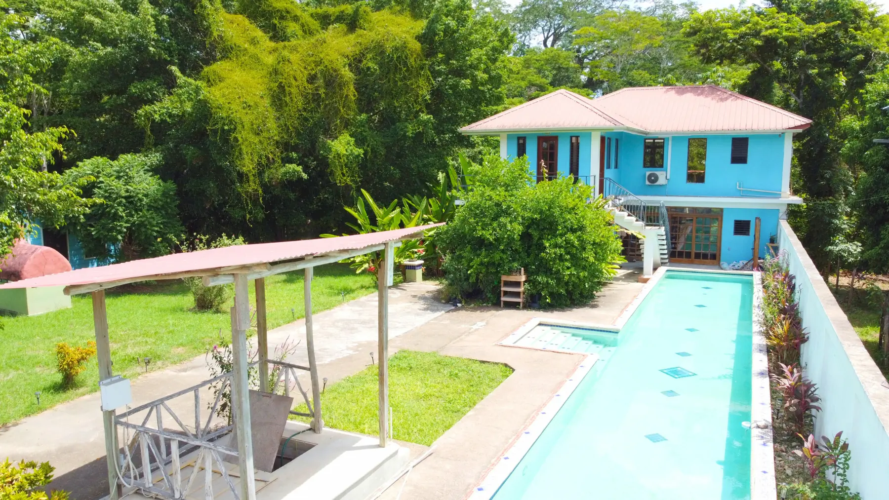 #4204 – Riverfront Property with Multiple Buildings + Lap Pool near San Ignacio Town, Cayo, Belize